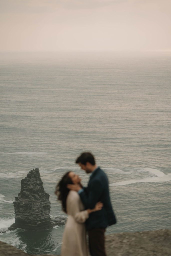 Couple lost in love with a beautiful sea backdrop