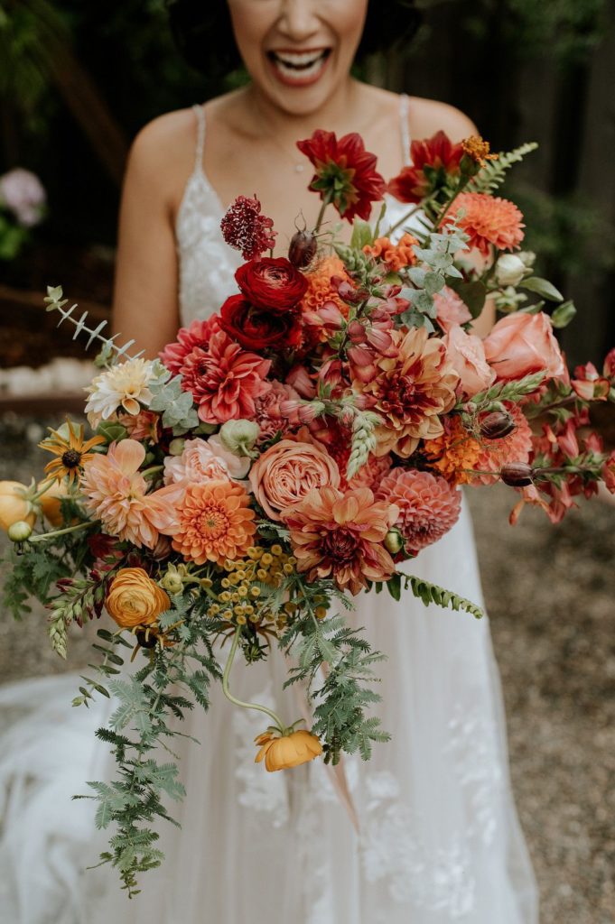 Top 20 Wedding Bouquets for 2023 (And Their Season!) 4 fall colors featured in bouquet
