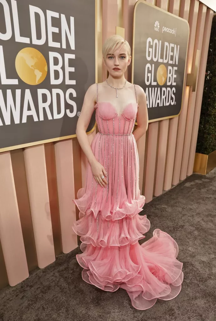 Julia Garner dazzles in a light pink Gucci gown with crystal overlay and mermaid silhouette at the 2023 Golden Globes 