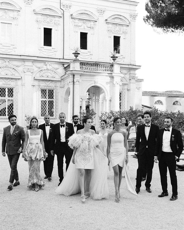 Bridal party strolling the Italian villa grounds.