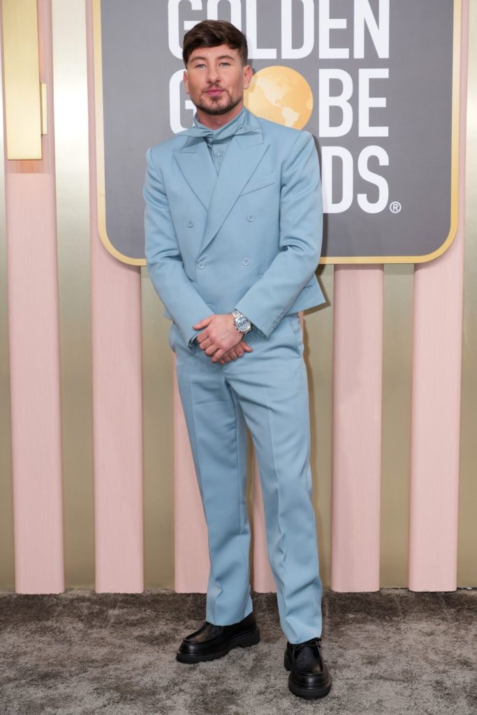 Irish actor Barry Keoghan on the 2023 Golden Globe red carpet with a sky blue Louis Vuitton peak-lapel suit, a bold monochromatic look