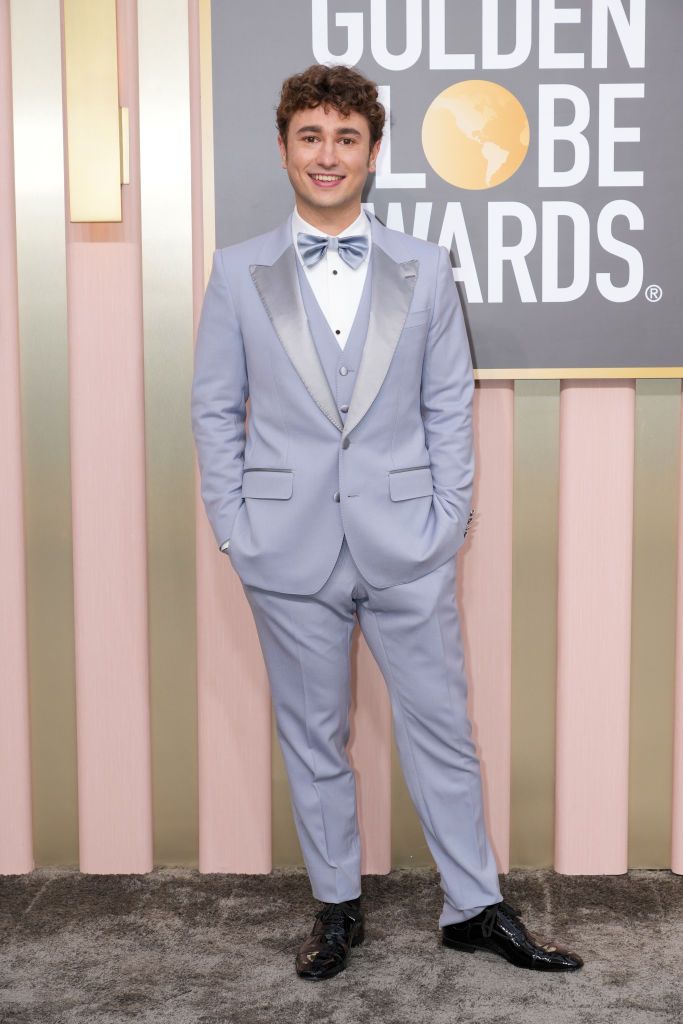 Gabriel LaBelle on the red carpet by embracing the 2022 Pantone colour of the year, periwinkle blue, for his tailored three-piece suit and bow tie combo