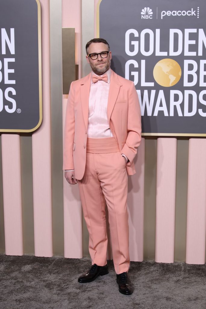Seth Rogen 2023 Golden Globe Awards in a bold pink suit, proving that men can confidently rock a striking pink look on the red carpet