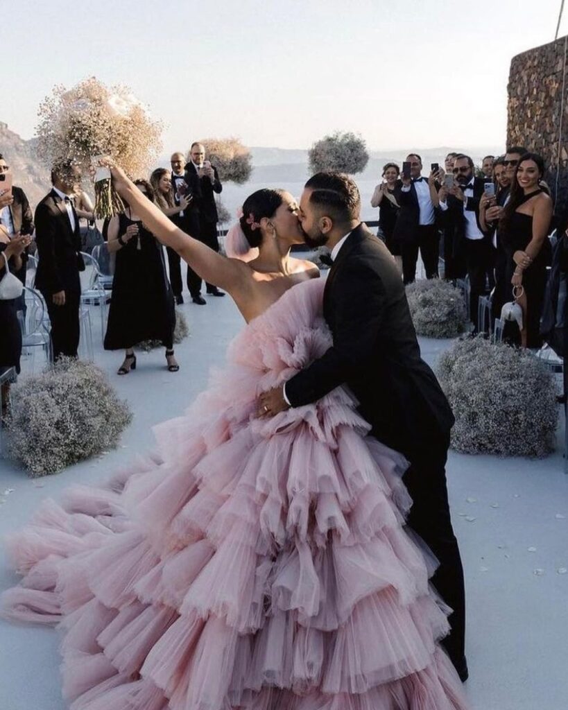 Bride in a stunning pink wedding dress