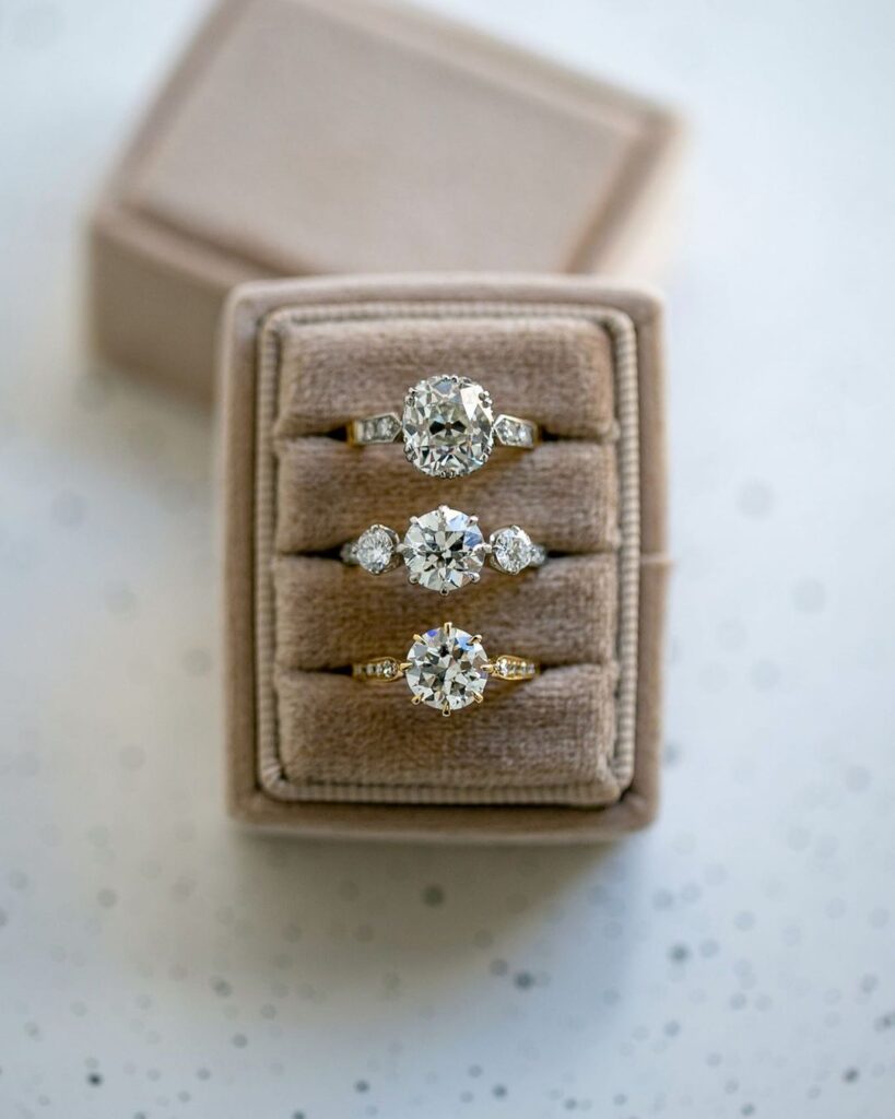 A set of stunning vintage engagement rings in a ring box.