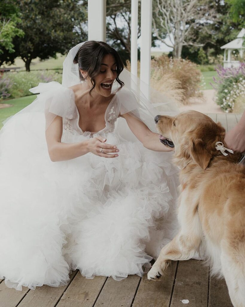 Happy bride with her pet in destination wedding