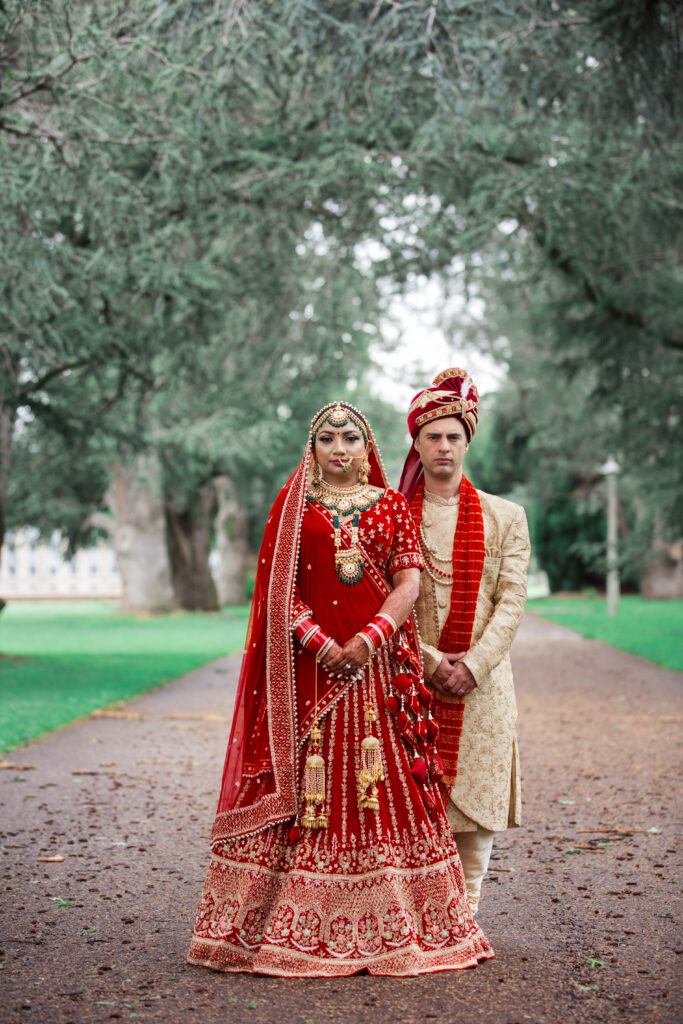 Bride and groom adorning traditional Indian dress