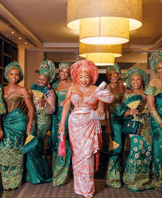 The bride and her bridal party in their stunning geles one of the Traditional Wedding Outfits.