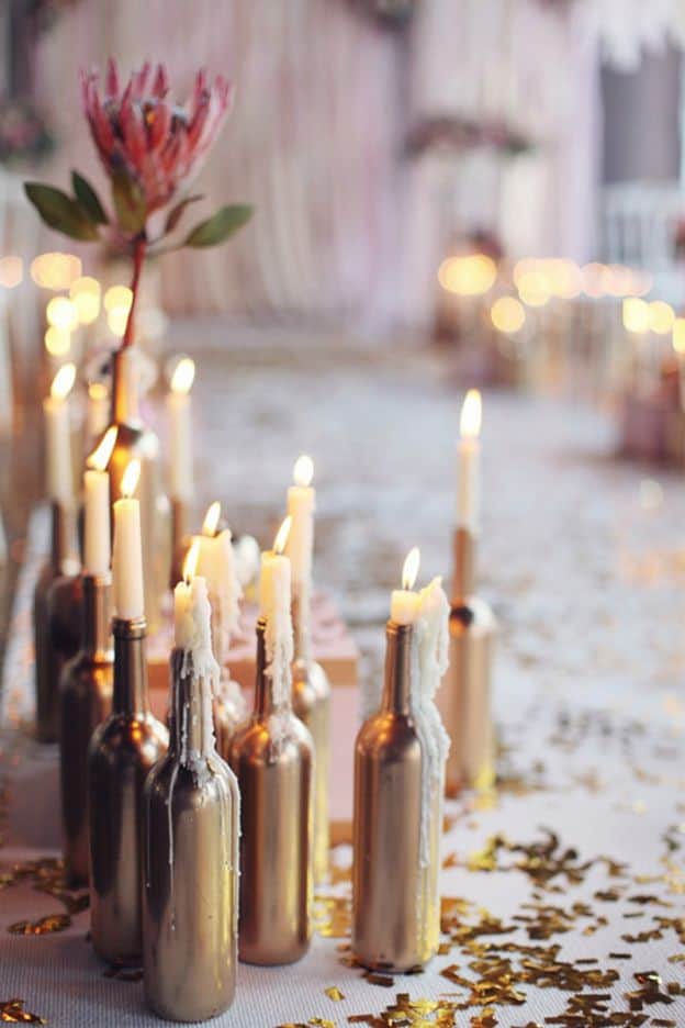 Candles in wine bottles