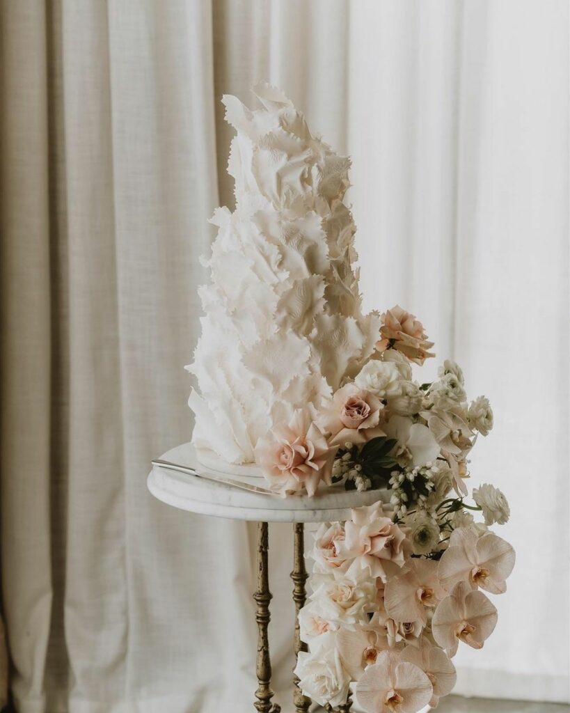 Taking 2023 wedding cake trends to another level with this intricately made floral cake.