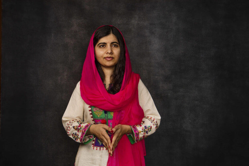 Malala Yousafzai posing in her traditional attire. 