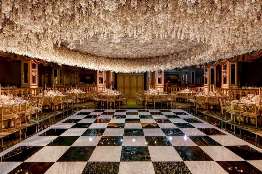 A breathtaking dance floor with cascading flowers on the ceiling that will make you want to look up.
