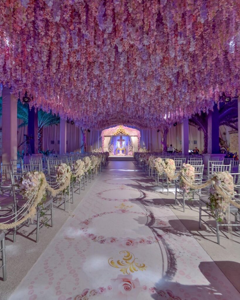 A breathtaking ceremony under pink cascading flowers by Preston Bailey weddings.