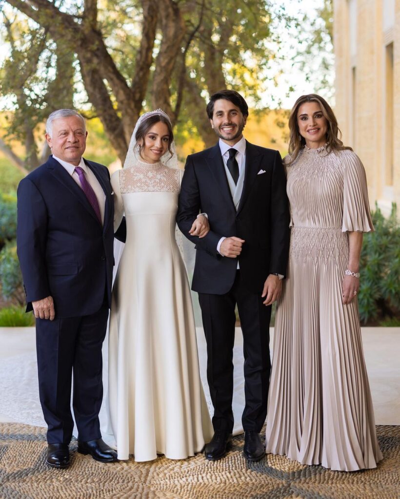 Princess Iman poses with her new husband, mother, Queen Rania and her father. 