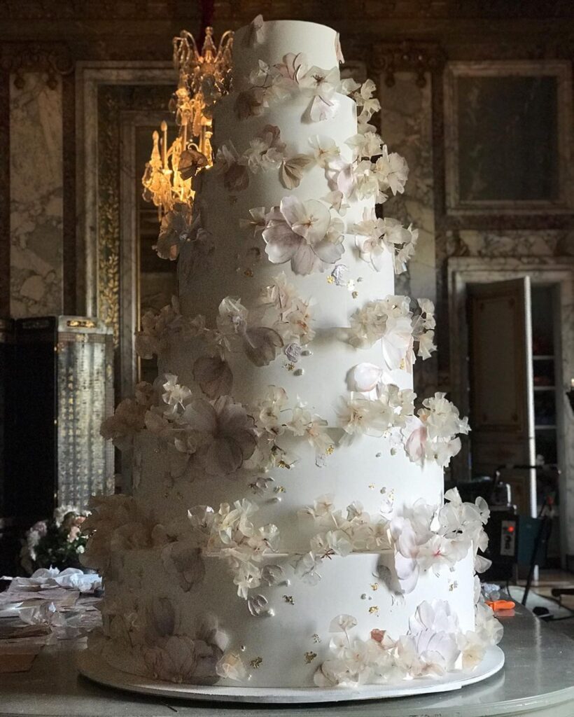 This towering cake with elegant features and dreamy florals.