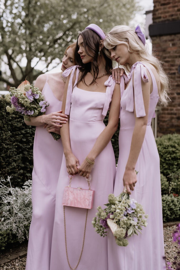 Bridesmaid color trends and style include these lavender-colored dresses.