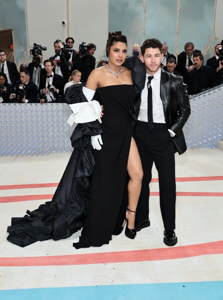 Nick Jonas and Priyanka Chopra matching in black and white Valentino. 
