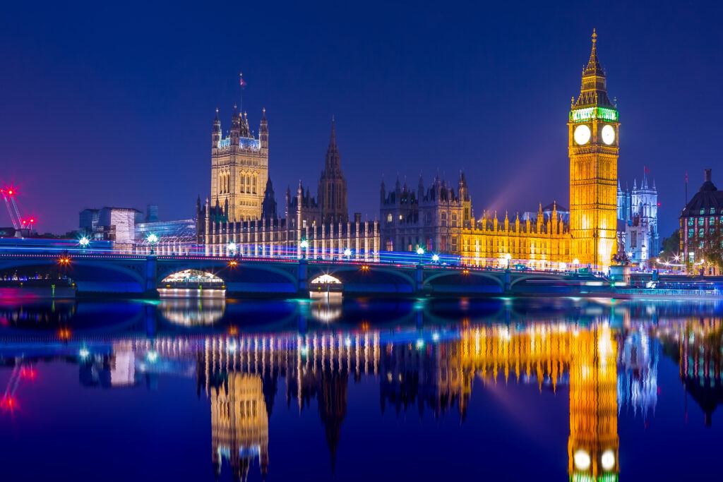 Big Ben clock tower on River Thames in Westminster, London at night. Long exposure.