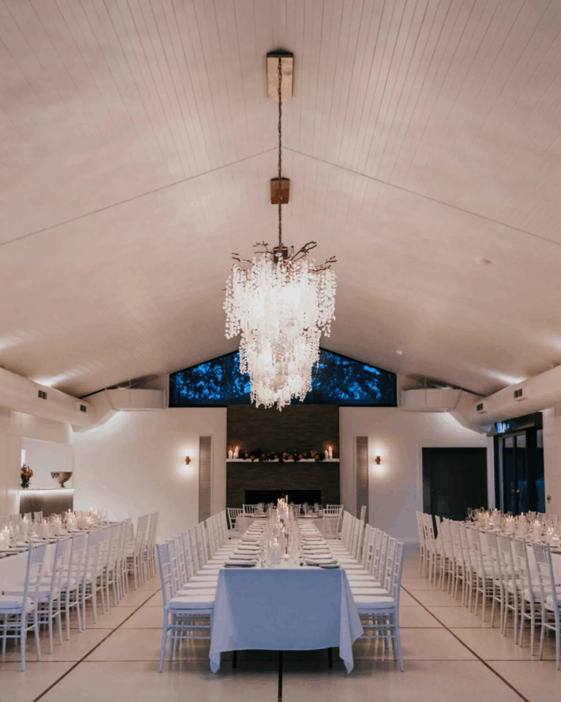 100 Breathtaking and Exclusive Australian Wedding Venues on every Couples Wish List! 24 Elegant dining setup in the Function Centre at Greystone Estate, featuring a chandelier and tables arranged for a wedding reception in the Hunter Region.